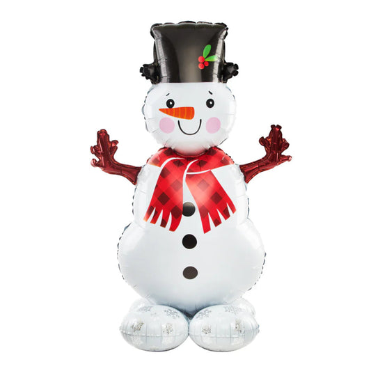 Globo navideño de foil con figura de muñeco de nieve y un patín, unidos por cinta.
