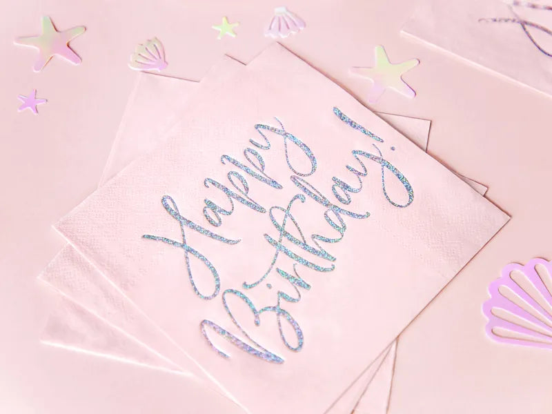 Detalle de servilleta rosa con texto brillante