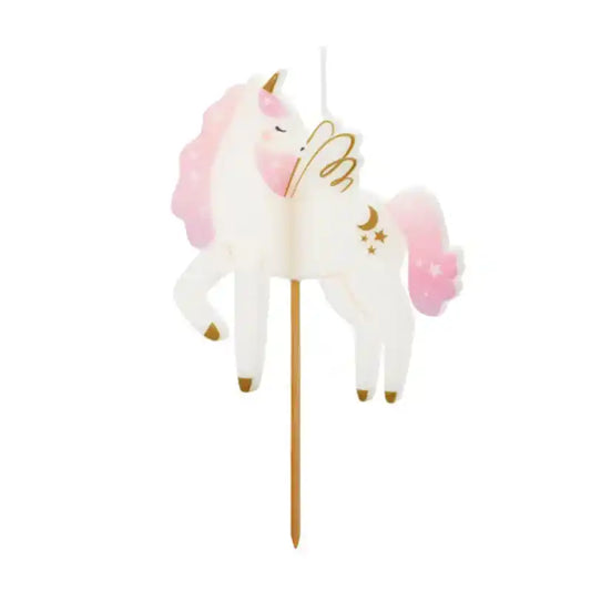 Vela blanca de forma de unicornio